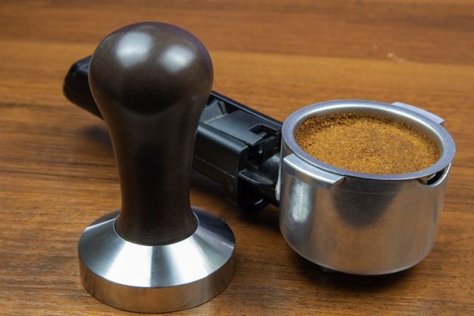 photo of a coffee maker tamper