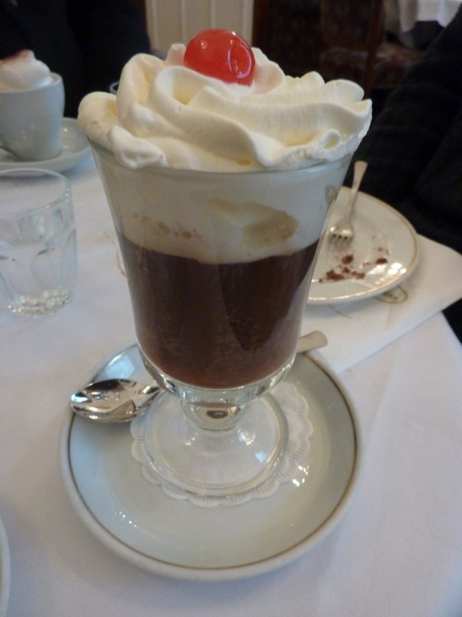 Fiacre coffee in a glass with cream, decorated with cherries