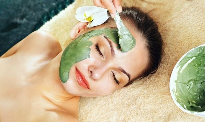 Applying a green tea mask to your face